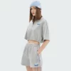 woman zip up cropped t-shirt with polo neck and drawstring sides - Image 6