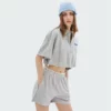 woman zip up cropped t-shirt with polo neck and drawstring sides - Image 5